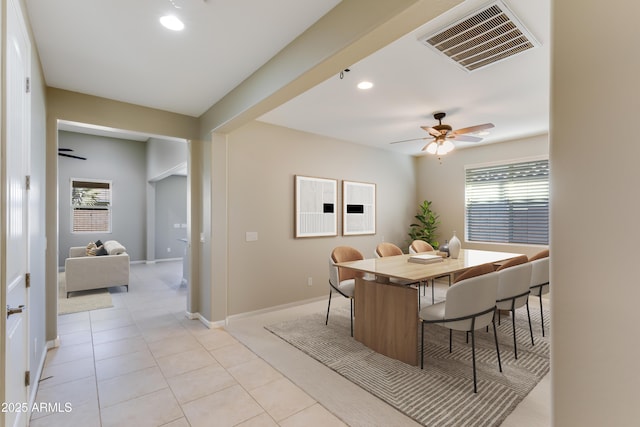 dining room with light tile patterned floors and ceiling fan