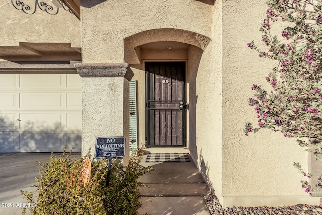 entrance to property with a garage