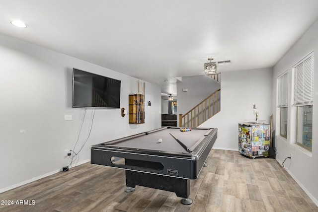 game room with hardwood / wood-style floors and pool table