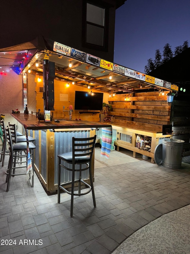 view of patio with an outdoor bar