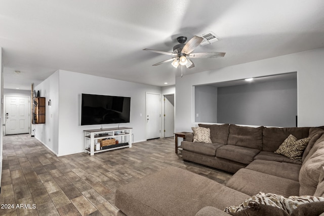 living room with hardwood / wood-style flooring and ceiling fan