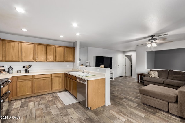 kitchen with stainless steel dishwasher, kitchen peninsula, and hardwood / wood-style flooring