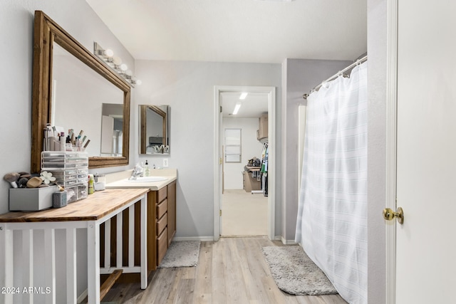 bathroom featuring hardwood / wood-style floors and vanity