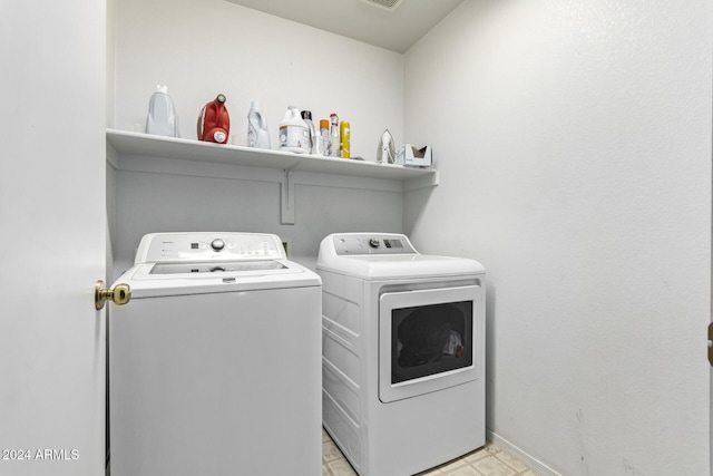 laundry area with washing machine and dryer