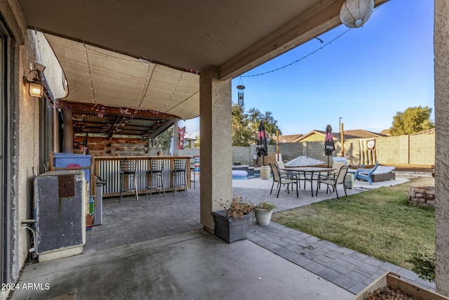 view of patio with exterior bar