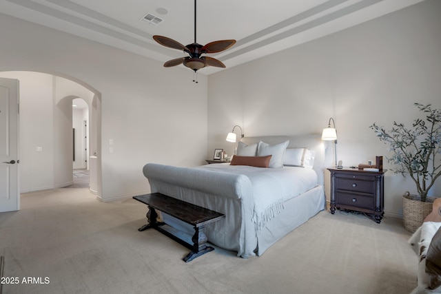 bedroom featuring ceiling fan and light colored carpet