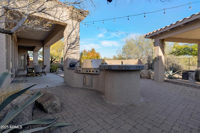 view of patio / terrace featuring area for grilling and exterior kitchen