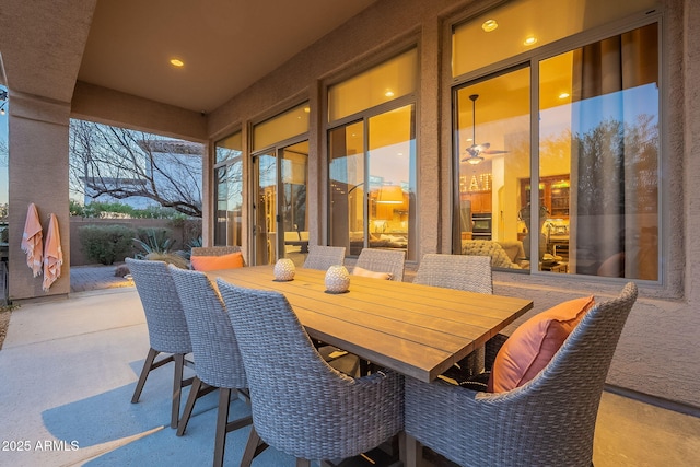 view of patio terrace at dusk