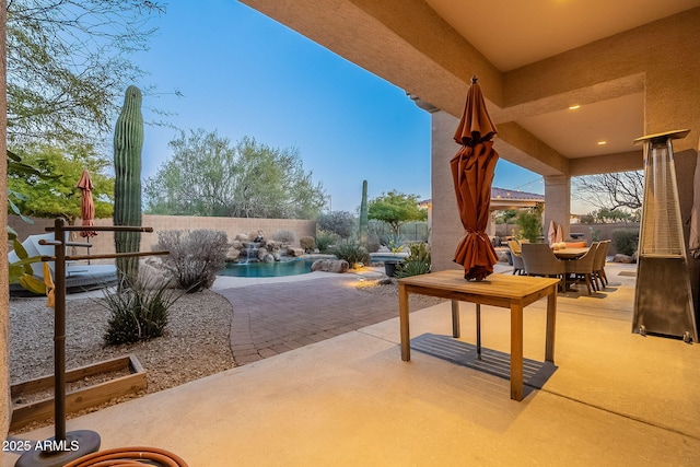 view of patio featuring a fenced in pool