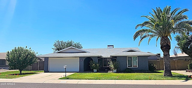 5751 W Muriel Dr, Glendale, AZ 85308 - ranch-style home with concrete driveway, a garage, and stucco siding