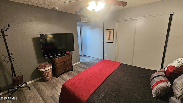 5751 W Muriel Dr, Glendale, AZ 85308 - bedroom featuring wood finished floors, a closet, a textured ceiling, and ceiling fan