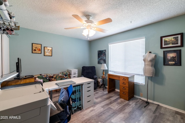 5751 W Muriel Dr, Glendale, AZ 85308 - home office with wood finished floors, healthy amount of natural light, a ceiling fan, and a textured ceiling