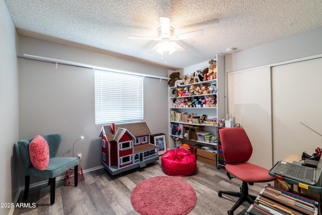5751 W Muriel Dr, Glendale, AZ 85308 - home office with wood finished floors, a textured ceiling, and a ceiling fan