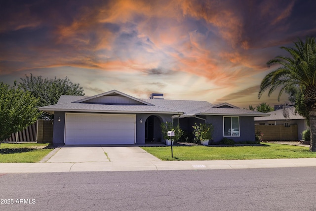 5751 W Muriel Dr, Glendale, AZ 85308 - ranch-style house featuring a garage, concrete driveway, and stucco siding