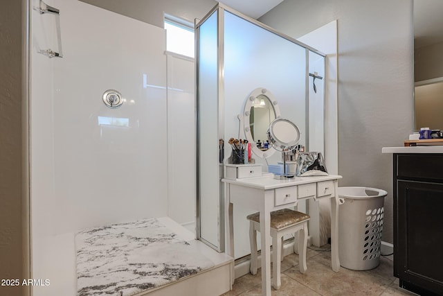 bathroom with tile patterned flooring and a shower