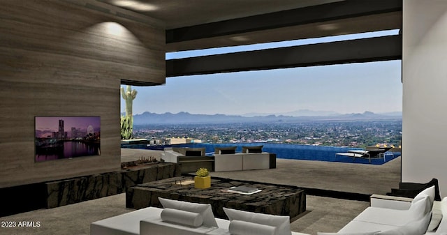 view of patio / terrace featuring a mountain view and an outdoor hangout area