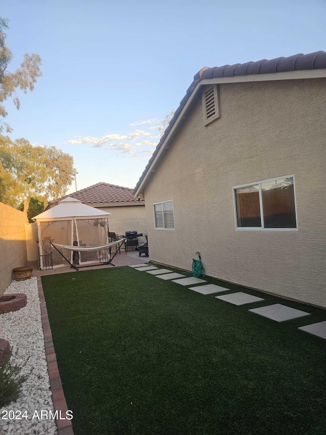 view of yard featuring a patio and a gazebo