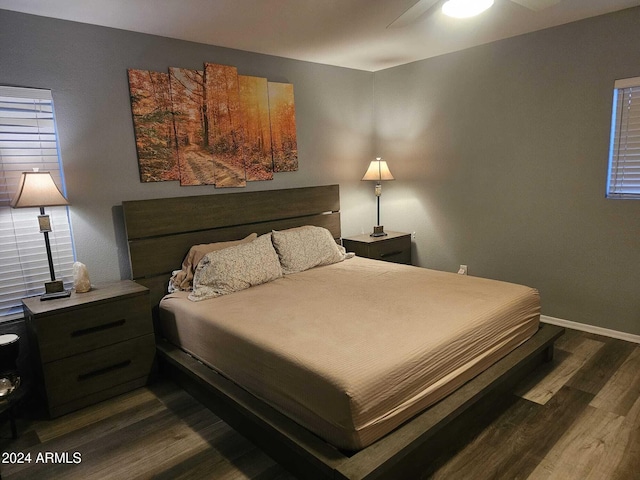 bedroom featuring dark hardwood / wood-style flooring and ceiling fan