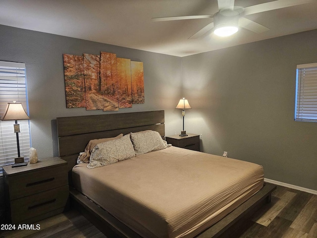 bedroom with ceiling fan and dark wood-type flooring