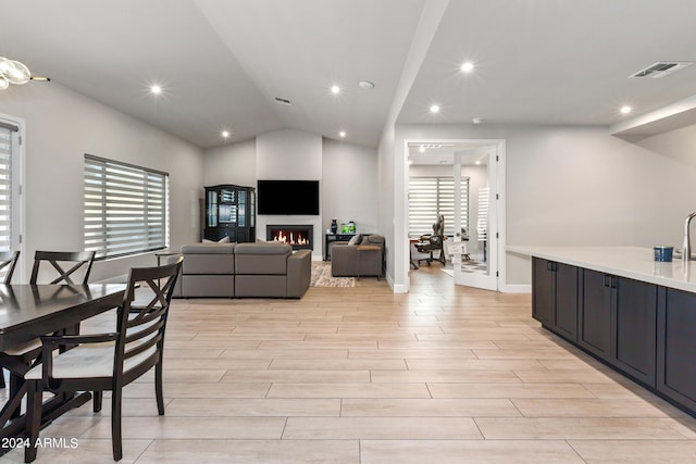 interior space with a fireplace and lofted ceiling