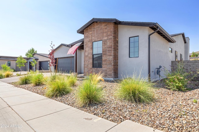 view of side of property with a garage