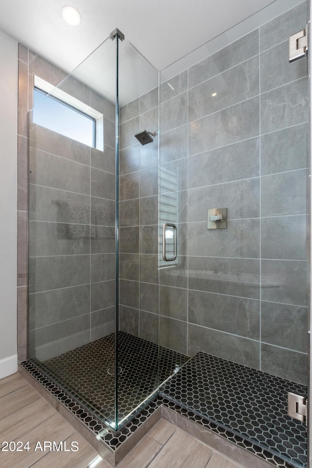 bathroom featuring an enclosed shower