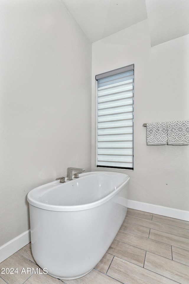 bathroom with a tub