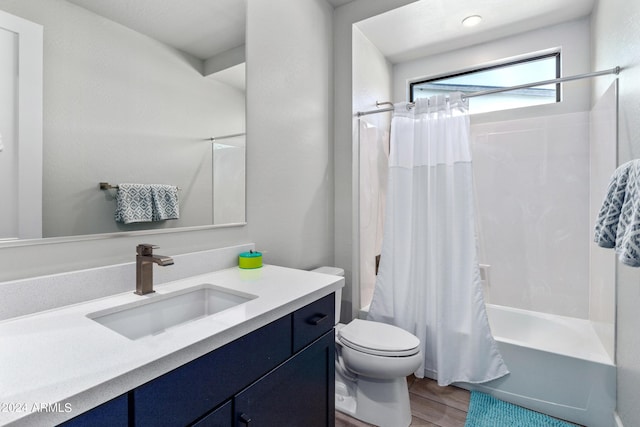 full bathroom with wood-type flooring, toilet, vanity, and shower / tub combo with curtain