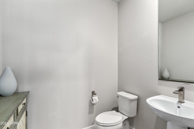 bathroom with sink and toilet