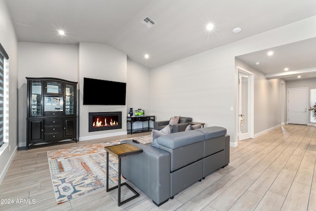 living room with vaulted ceiling