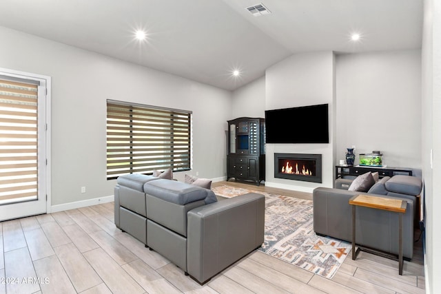 living room with lofted ceiling