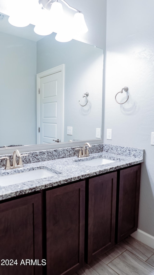 bathroom featuring vanity and hardwood / wood-style flooring