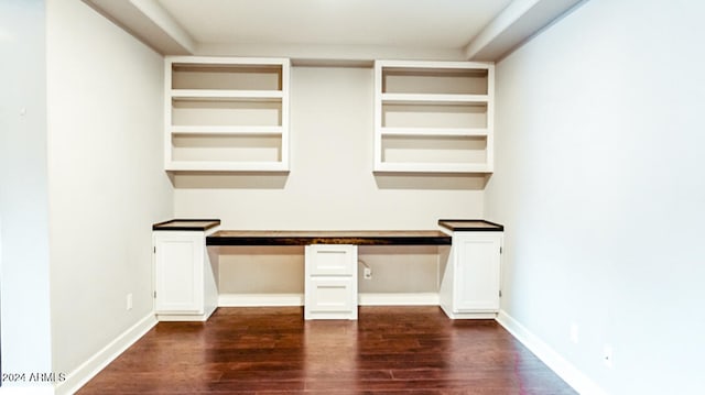 unfurnished office featuring dark hardwood / wood-style floors