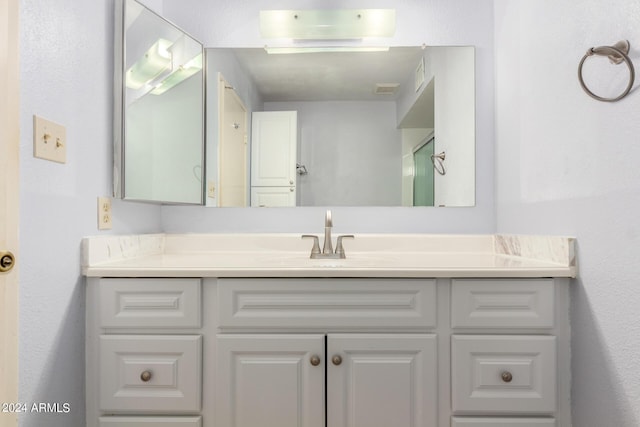 bathroom featuring visible vents and vanity