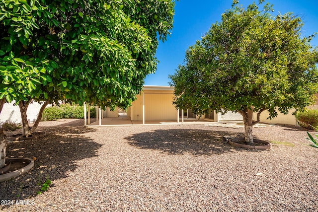 view of front of house with fence and a patio