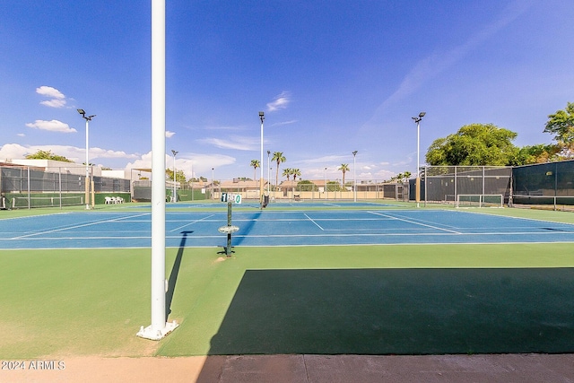 view of sport court featuring fence and community basketball court