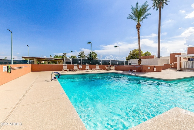 view of swimming pool featuring a patio