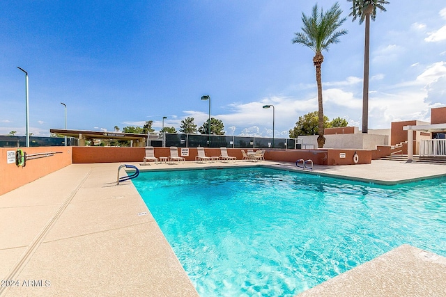 view of pool featuring a patio