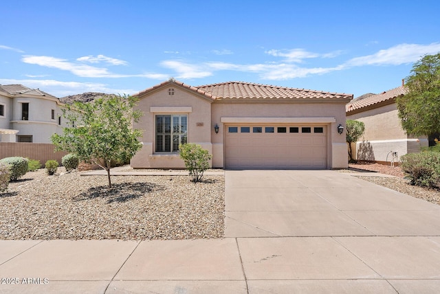 3026 W Silver Fox Way, Phoenix, AZ 85045 - mediterranean / spanish-style house featuring stucco siding, concrete driveway, a garage, and a tiled roof