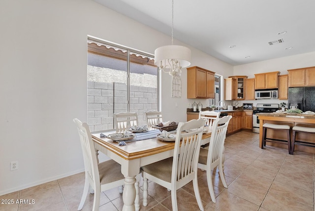 3026 W Silver Fox Way, Phoenix, AZ 85045 - dining area with plenty of natural light and light tile patterned flooring