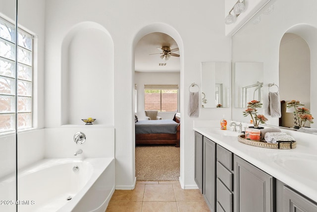 3026 W Silver Fox Way, Phoenix, AZ 85045 - full bath featuring ensuite bath, ceiling fan, a bath, double vanity, and tile patterned floors