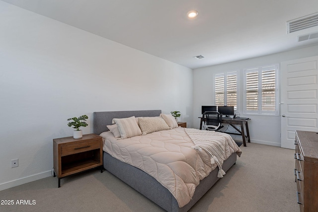 bedroom featuring baseboards, visible vents, and light colored carpet