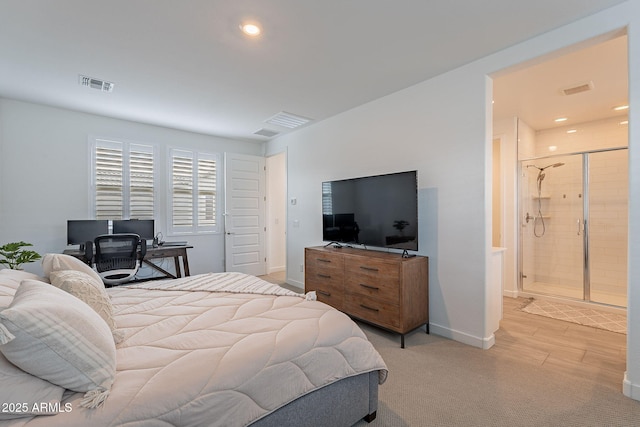 bedroom featuring ensuite bathroom, recessed lighting, visible vents, and baseboards