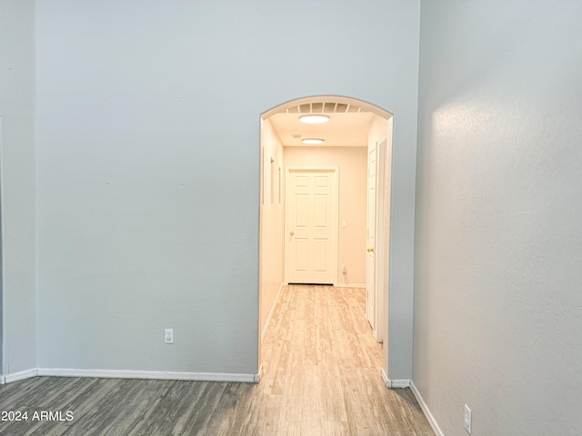 hall with wood-type flooring