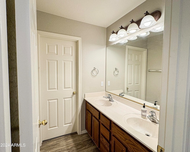 bathroom with vanity and hardwood / wood-style floors