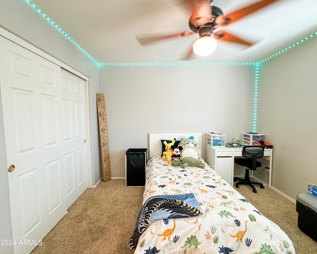 carpeted bedroom with a closet and ceiling fan