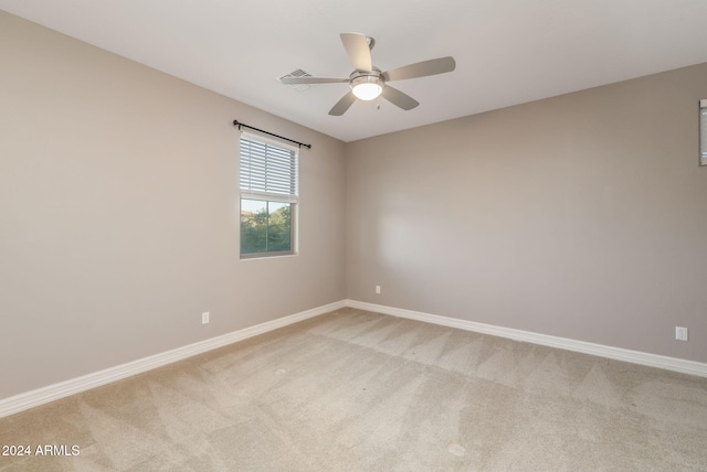 carpeted empty room with ceiling fan