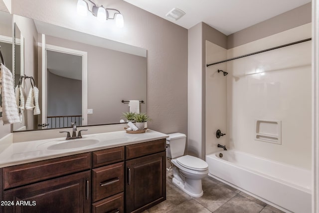 full bathroom with tile patterned floors, shower / washtub combination, vanity, and toilet