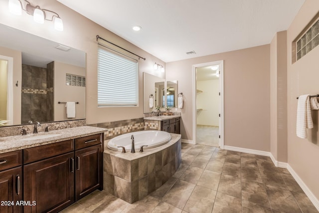 bathroom with vanity, separate shower and tub, and tile patterned floors