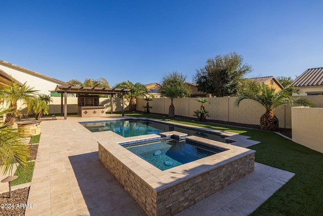 view of pool with an in ground hot tub, a patio, and a pergola